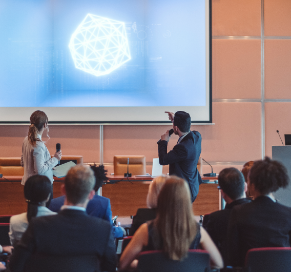 Scientists Presenting To Large Group